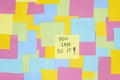 Multicolored sticky paper notes with a written message
