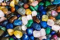Multicolored stones. Semi-precious stones, crystals and other minerals, displayed for sale in a fair Royalty Free Stock Photo