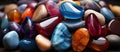 multicolored stones and stones on a black background, close-up