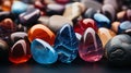 multicolored stones and stones on a black background, close-up