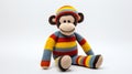 Colorful Crocheted Monkey Toy With Striped Sweater And Pants