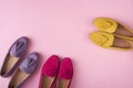 Multicolored suede moccasins shoes over pink background