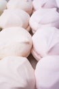 Multicolored sweet marshmallows close-up, vertical frame