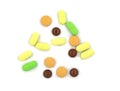 Multicolored tablets and pills on a white background Royalty Free Stock Photo