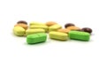Multicolored tablets and pills on a white background Royalty Free Stock Photo