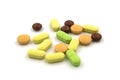 Multicolored tablets and pills on a white background Royalty Free Stock Photo
