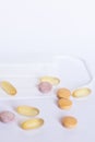 Multicolored tablets on a white background Royalty Free Stock Photo