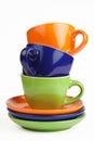 Multicolored teacups and saucers Royalty Free Stock Photo