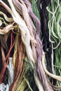 Multicolored threads for cross stitching, macrome, vertical frame Royalty Free Stock Photo