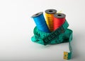 Multicolored threads, scissors and ruler. Royalty Free Stock Photo