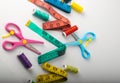 Multicolored threads, scissors and ruler. Royalty Free Stock Photo