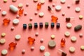 Multicolored title DEPRESS from black cubes on the table with tablets on coral background.