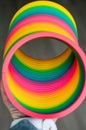 Multicolored Toy plastic rainbow Colored Spiral for Play and Stunts, Popular in the 90s Minimalism concept of toys Royalty Free Stock Photo