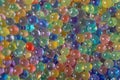 Multicolored transparent balls, spheres of rainbow colors made of water gel. Background. Copy Space Royalty Free Stock Photo
