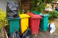 Multicolored trash bins for sorting garbage on a Thai street