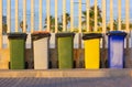 Multicolored trash cans for sorting different types of trash. Recycling bins Royalty Free Stock Photo