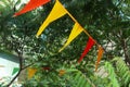 multicolored triangular flags on a tent