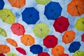 Multicolored umbrellas on the sky background