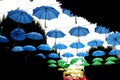 Multicolored umbrellas hanging in the air