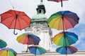 Multicolored umbrellas hanging infront of church