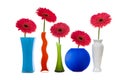 Multicolored vases and pink gerberas