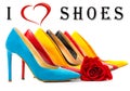 Multicolored women`s shoes with high heels standing in a row on a white surface with a red rose,Text I love shoes written in the