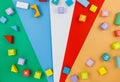 Multicolored wooden blocks on a red blue-green background. Trendy puzzle toys. Geometric shapes. Educational toys Royalty Free Stock Photo