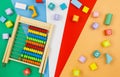 Multicolored wooden blocks on a red blue-green background. Trendy puzzle toys. Geometric shapes. Educational toys Royalty Free Stock Photo