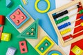 Multicolored wooden blocks on a red blue-green background. Trendy puzzle toys. Geometric shapes. Educational toys Royalty Free Stock Photo