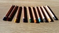 Multicolored wooden pencils triangular in section are designed for the development of fine motor skills