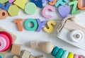 Multicolored wooden toys cubes, pyramid, letters, numbers on white wooden background. Set colorful toys for games in kindergarten Royalty Free Stock Photo