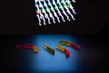 Multicolored worms made of gelatin against the background of multicolored