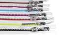 Multicolored Zippers or Zip Fasteners used for binding fabric or textile. Colorful Clasp Lockers Background or Pattern concept of