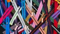 Multicolored Zippers or Zip Fasteners used for binding fabric or textile.