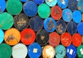 Multicolors old rusty oil barrels stack in rows Royalty Free Stock Photo