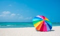 Colourful rainbow umbrella on beautiful sunny day, Arashi Beach Aruba, Caribbean Royalty Free Stock Photo