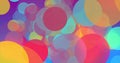 Multicoloured circles moving and multiplying to fill a graduated blue background Royalty Free Stock Photo