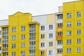 Multicoloured high-rise residential buildings in affluent areas. Multi-apartment multi-storey building with a multicolored facade Royalty Free Stock Photo