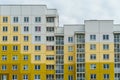 Multicoloured high-rise residential buildings in affluent areas. Multi-apartment multi-storey building with a multicolored facade Royalty Free Stock Photo
