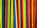 Multicoloured rainbow drinking straws lined up in row. Festive concept, party, birthday. Pattern background Royalty Free Stock Photo