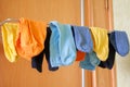 Multicoloured socks drying at home