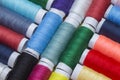 Multicoloured spools of thread arranged in a rows Royalty Free Stock Photo