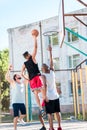 multicultural basketball team playing basketball together