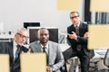 multicultural businessmen looking at notes during meeting Royalty Free Stock Photo
