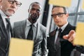 multicultural businessmen looking at notes during meeting Royalty Free Stock Photo