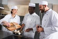 multicultural chefs preparing mushrooms