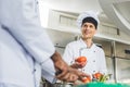 multicultural chefs preparing salad