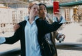 Multicultural couple taking a selfie on a city bridge Royalty Free Stock Photo