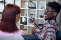 Multicultural couple using mobile for video call with family Royalty Free Stock Photo