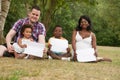 Multicultural family with blank boards Royalty Free Stock Photo